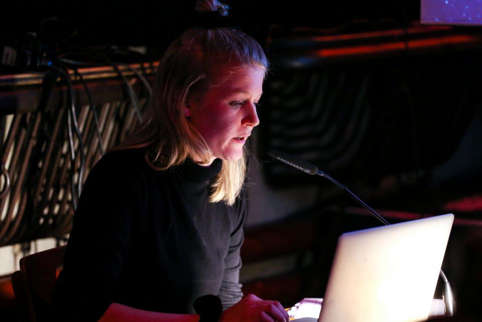 Girl and her laptop during a performance
